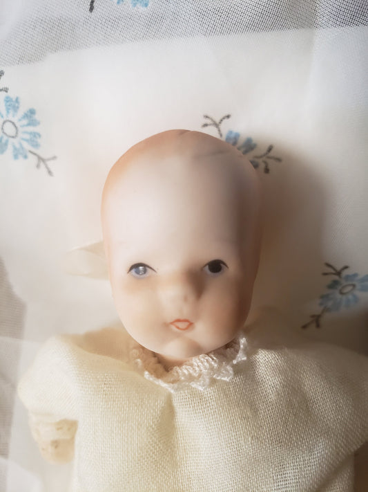 Vintage Blue Eyed Baby Doll in Gown